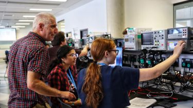 Dr. Gavin Williams teaching students at the University Insights Day for the Department of Electronic and Electrical Engineering