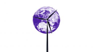 Wind turbine in front of a globe.