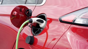 Image of a red electric car charging