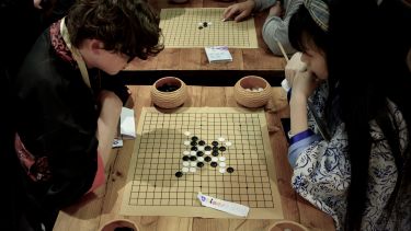 Event goers playing Go