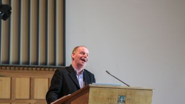 Photo of John Flint talking to guests at HCL 2022