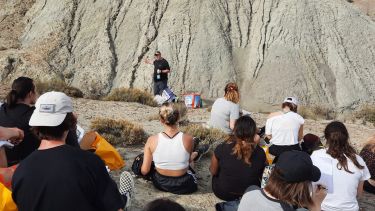 Students listen to a lecture on a fieldclass in Spain