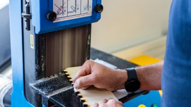 Student using a bandsaw