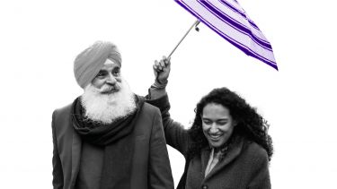 man and woman sharing umbrella