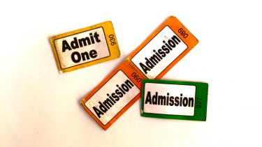 Pile of different coloured admission tickets