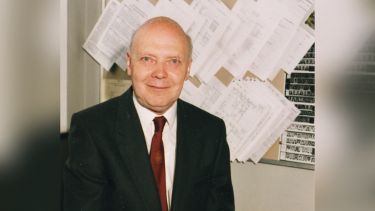 Professor Geoffrey Greenwood smiling to the camera