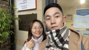 Teachers Li Junchi and Du Jiaxing outside the SCI