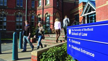 Students walking in and out of the Bartolome entrance