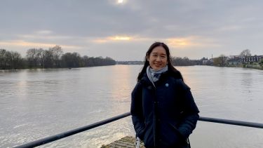 A woman stood in front of a river