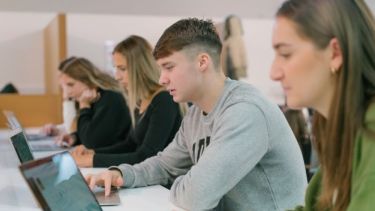 Luke in a lecture theatre