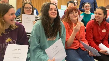 group of students with drama scripts
