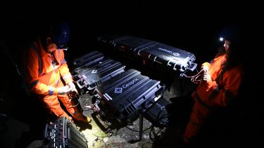 workers in a tunnel with geoptic equipment