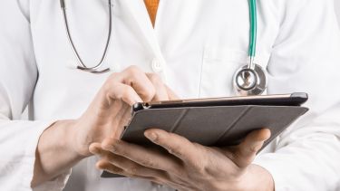 Doctor holding a tablet computer