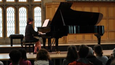 Pianist onstage performing