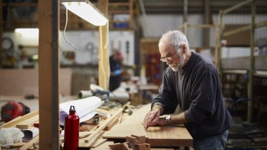 Older man working in workshop