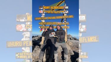 Brothers Toby and Josh at the top of Mount Kilimanjaro