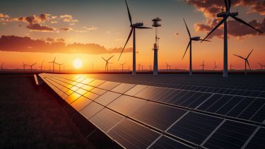 Stock photo of solar panels and wind turbines
