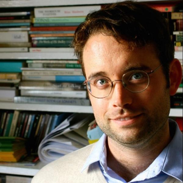 Profile picture of Daniel Eltringham surrounded by books