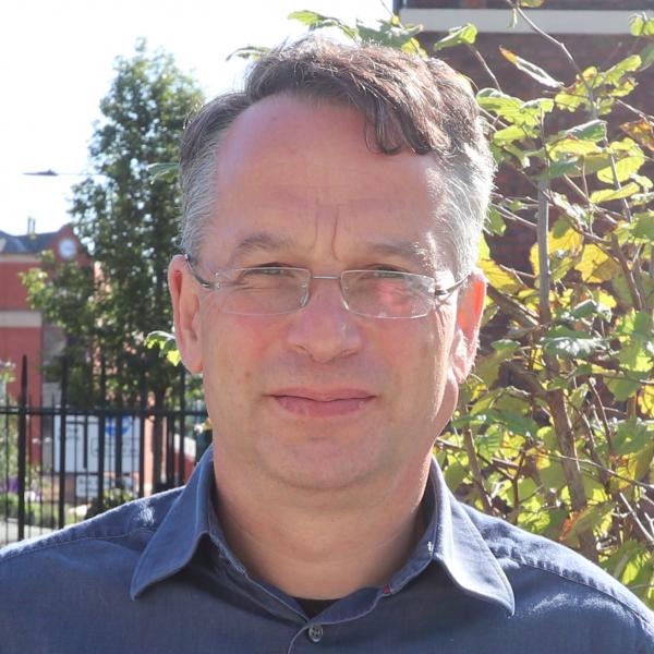 Profile picture of Bob Stern standing outside HRI building