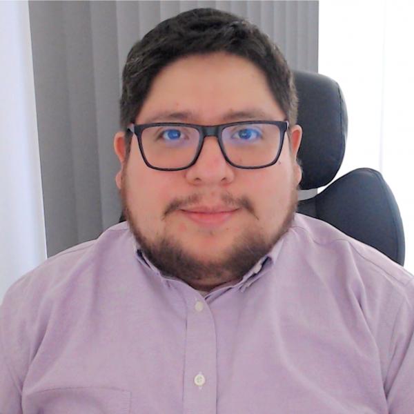 Profile picture of Dr. Mayo-Maldonado sat in his office