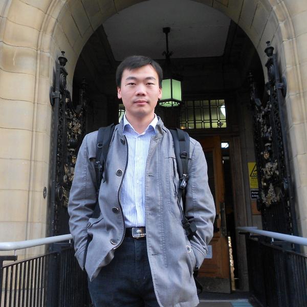 Profile picture of Dr Xiao Chen standing outside the Sir Frederick Mappin building