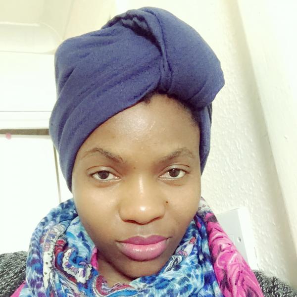 Profile picture of Nerea Okong'o wearing a colourful scarf and blue headwrap.