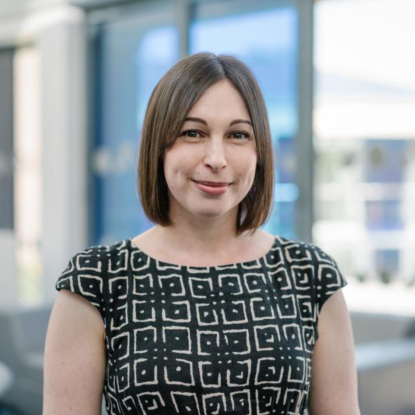 Profile picture of Karen Niven wearing a black and white patterned top.