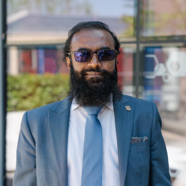 Profile picture of Sabur Mollah wearing a white shirt, blue tie and blue jacket.