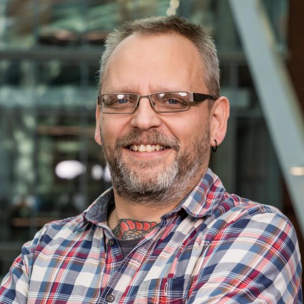 Profile picture of Dr Mark Ogden smiles stood in the Engineering Heartspace