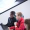 MSc Economics and Public Policy postgraduate Mwanda Phiri at computer with colleague