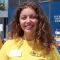 Hannah Dibble, English and History student, smiling at camera stood outside Blackwell's bookshop