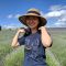 Yulan Liu, PhD Alumni. Standing in a field of lavender