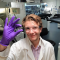 Gareth showing the results of a chemistry experiment - image