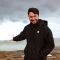 Adam Harris stood by a lagoon.