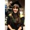 Emily Ball in cap and gown at graduation