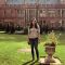 Bhadra standing on the grass in the sunny court yard at Firth Court