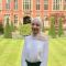 Profile photo of MSc student in front of a red brick building