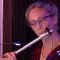 Flute player looking at music