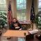 Image of IR & Politics student Peter Bland Reclining at the desk in the Oval Office, Washington DC