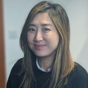 Gil Kook-Hee sitting at desk