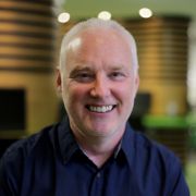 A profile photograph of Dr John Steel.