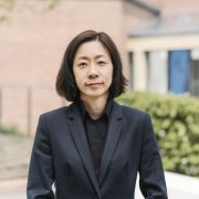 Yoo Jung Ha wearing a black shirt and jacket.