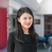 Shuyang Li stood outside the Employability Hub wearing a dark top and a black blazer.