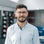 Tommaso Calzolari wearing a light blue shirt.