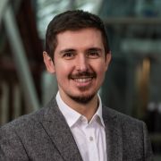 Dr Zoltán Kis smiles as he stands in the Engineering Heartspace