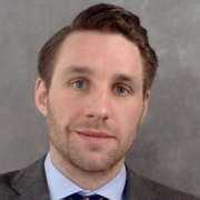 Headshot photo of Adam Brown
