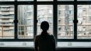 lonely person at window