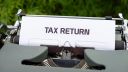 Tax Return written on a piece of paper set in a typewriter