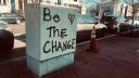 Grafitti which reads "be the change"