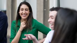 Photo of student laughing with group of friends